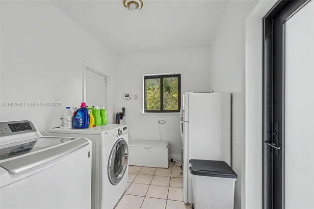 a view of a patio with couches chairs and a wooden floor