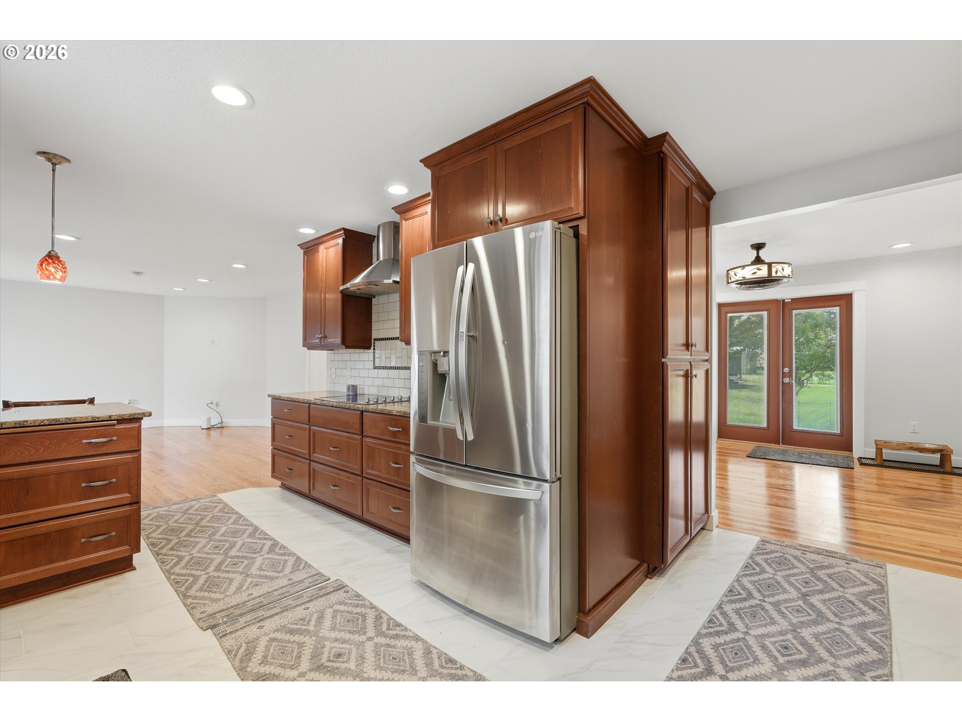 4621 Ohio Street Longview, WA 98632 - Photo 12 of 29 a kitchen with stainless steel appliances granite countertop a refrigerator and a stove top oven