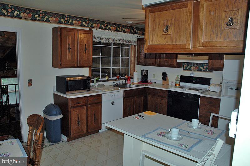 176 Petersburg Road Lancaster, PA 17601 - Photo 8 of 19 a kitchen with stainless steel appliances granite countertop a sink stove and cabinets