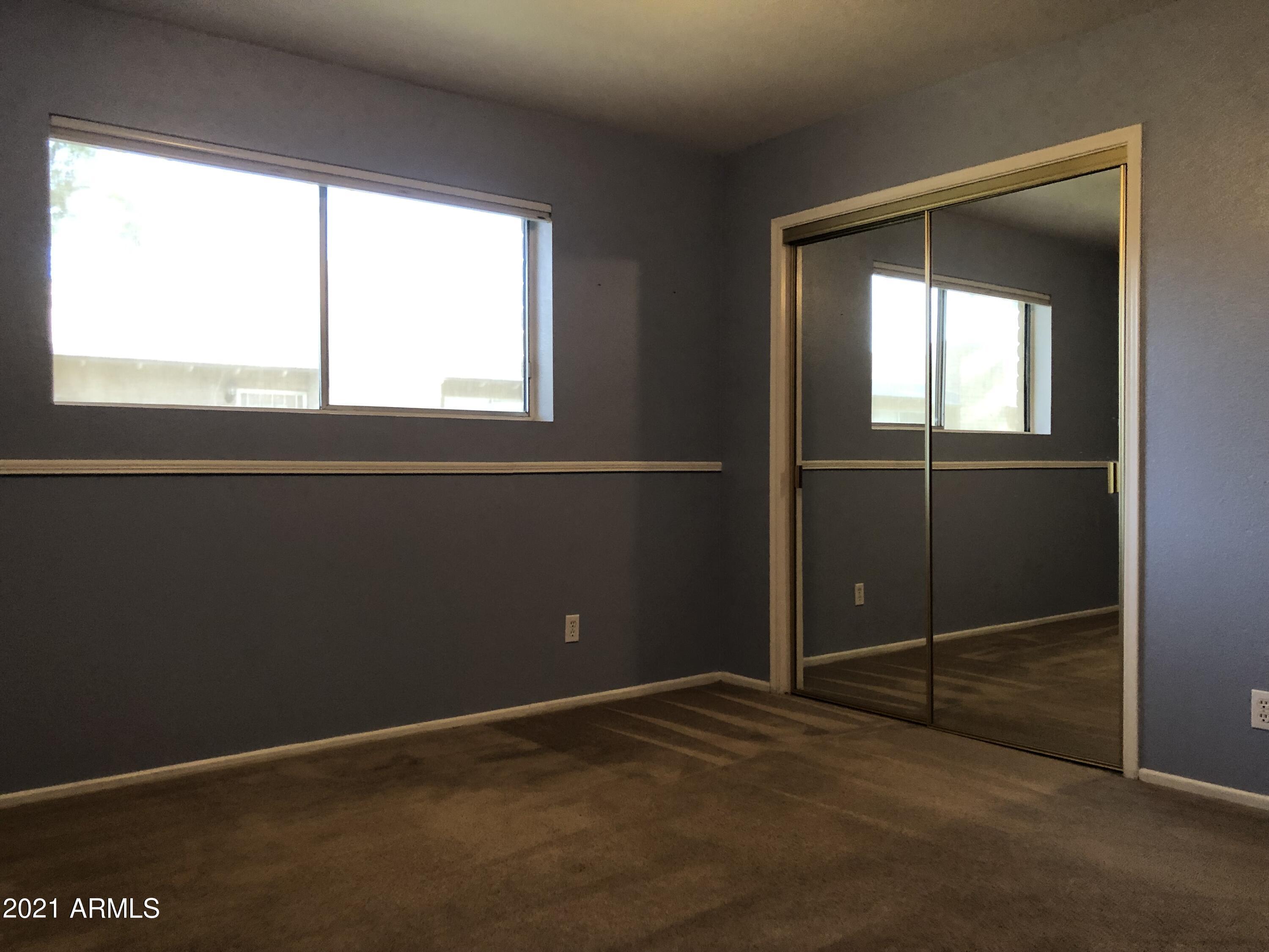 3031 South Rural Road, Unit 41 Tempe, AZ 85282 - Photo 11 of 23 a view of an empty room with a window