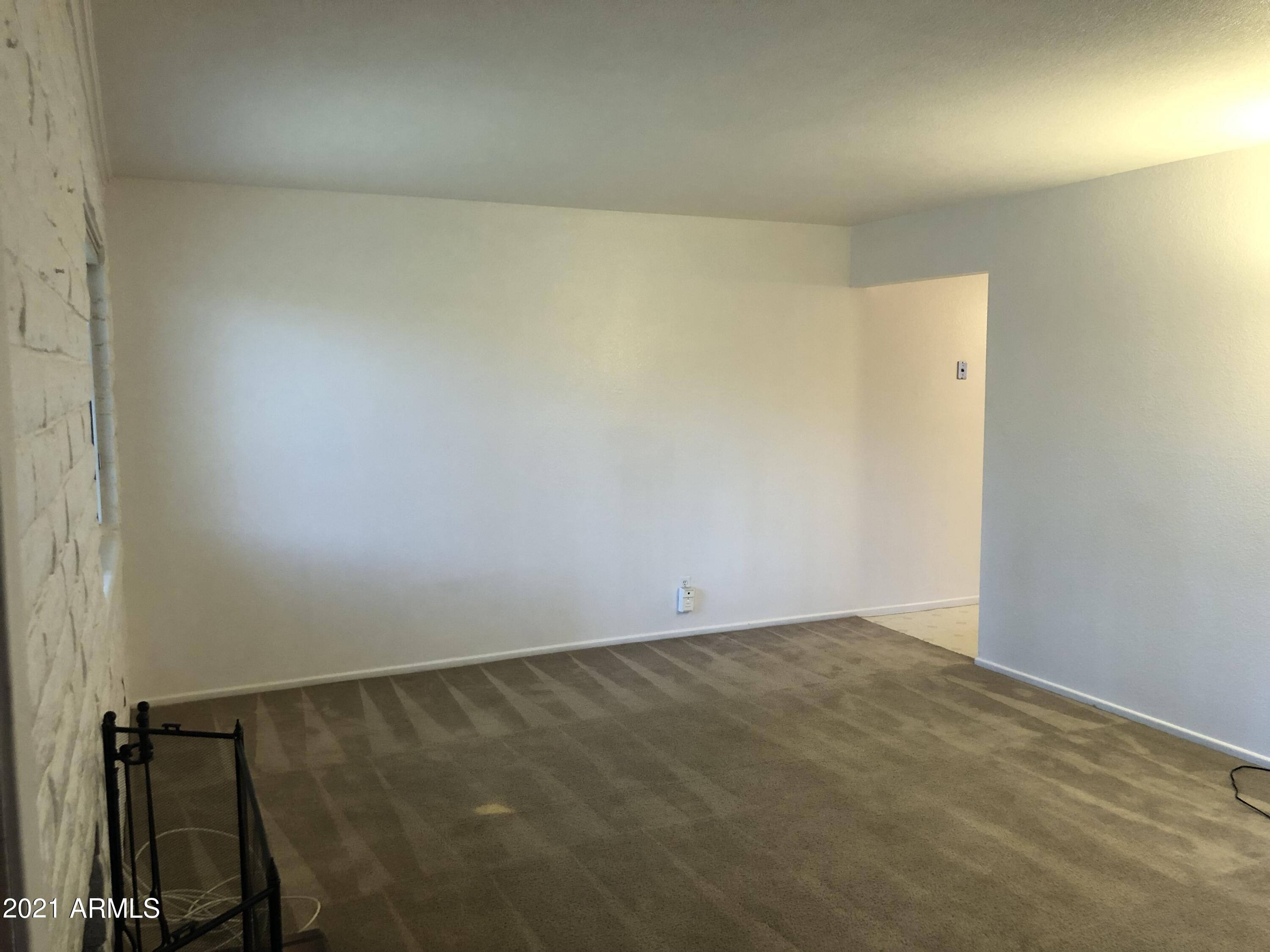 3031 South Rural Road, Unit 41 Tempe, AZ 85282 - Photo 4 of 23 an empty room with a workbench