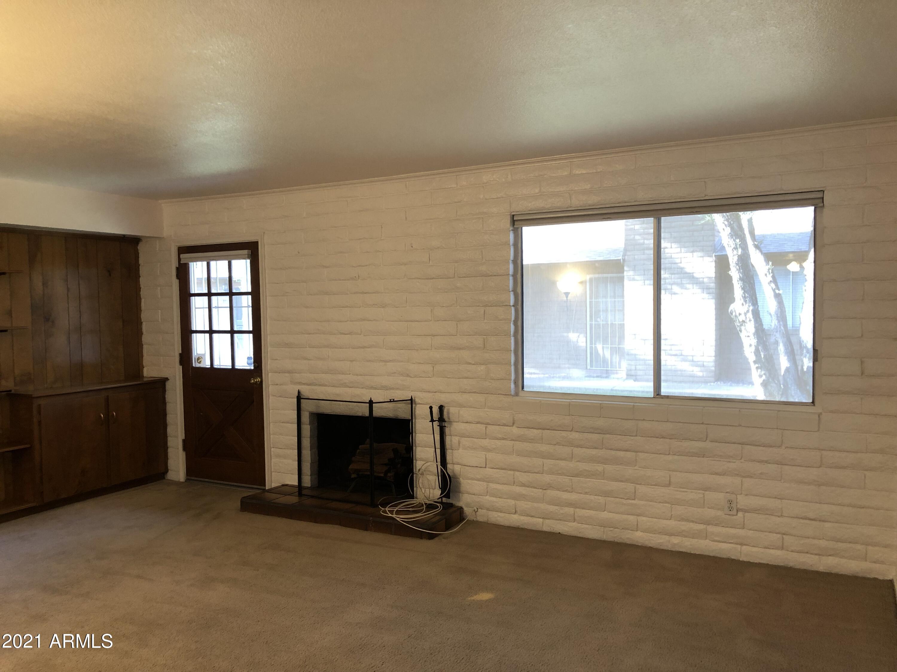 3031 South Rural Road, Unit 41 Tempe, AZ 85282 - Photo 5 of 23 an empty room with windows