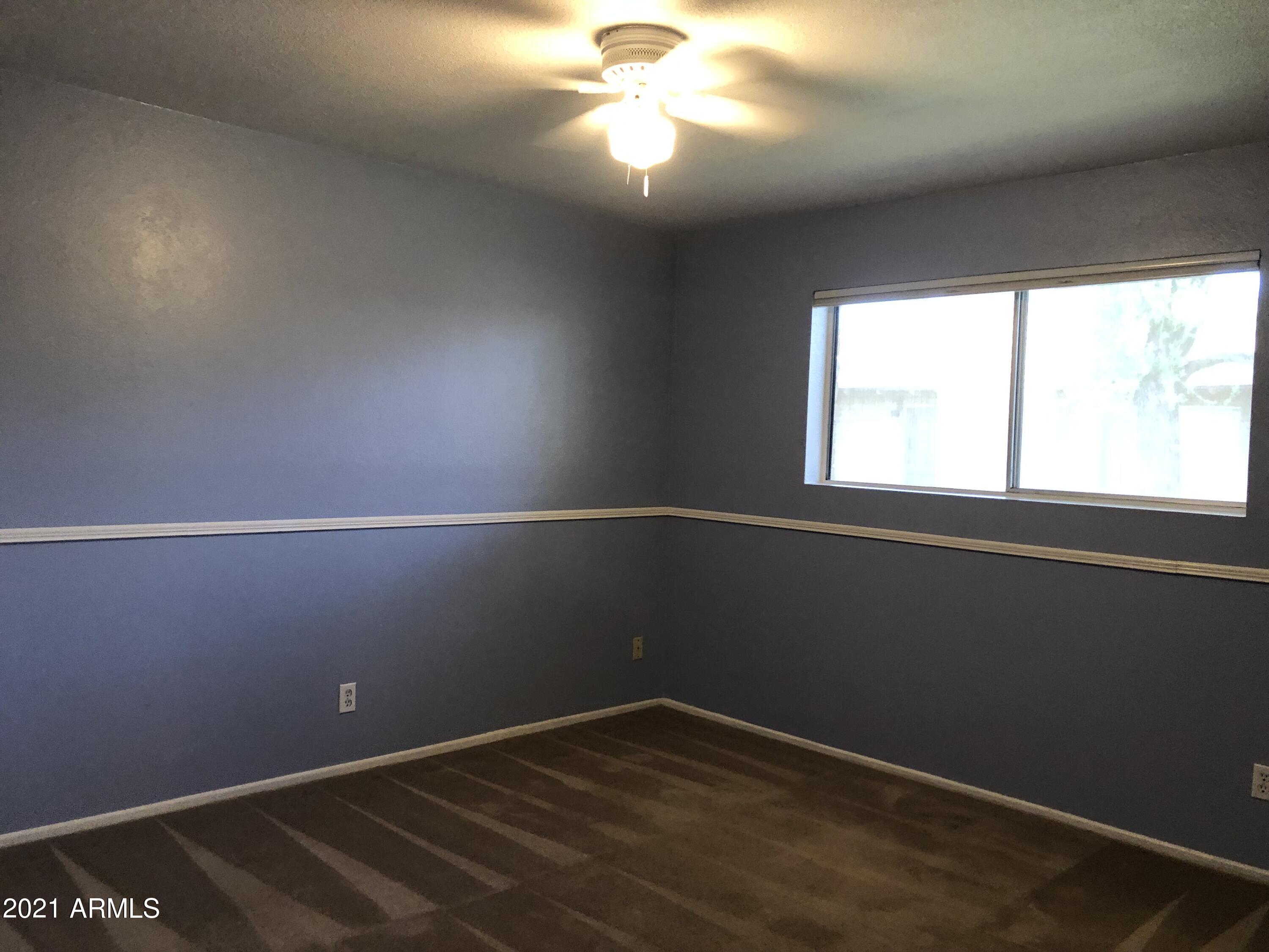 3031 South Rural Road, Unit 41 Tempe, AZ 85282 - Photo 10 of 23 an empty room with a window