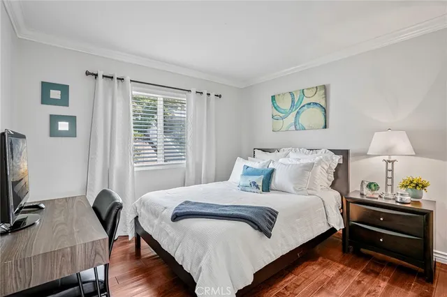 a bedroom with a bed and a desk