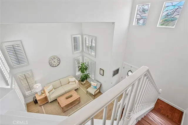 a living room with furniture and flowers