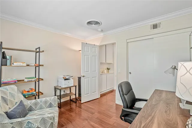 a view of a workspace with furniture and lounge chair