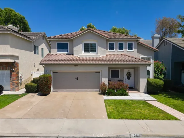 a house view with a garden space