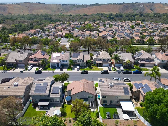 an aerial view of a houses with a lake view