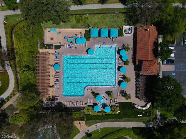 an aerial view of a house with garden space and street view