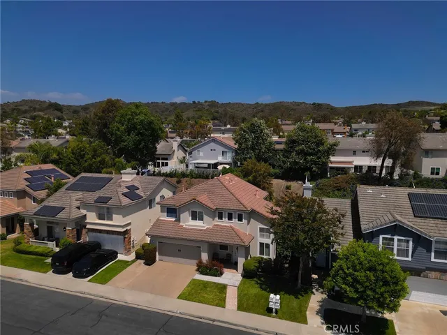 an aerial view of residential houses and city street