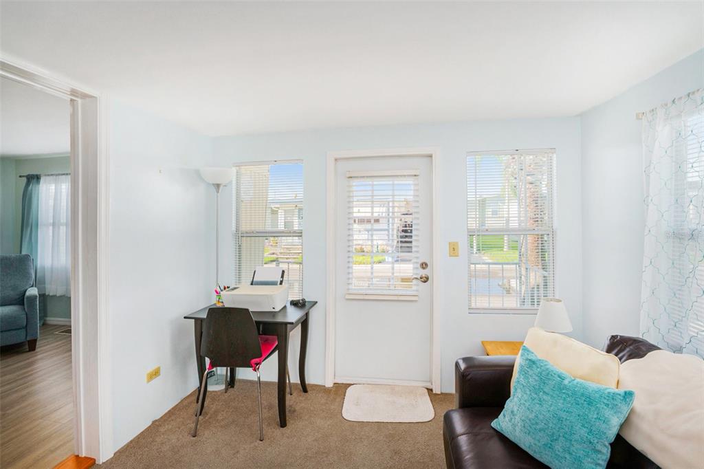 34527 Violet Drive Pinellas Park, FL 33781 - Photo 12 of 27 a living room with furniture a rug and a window