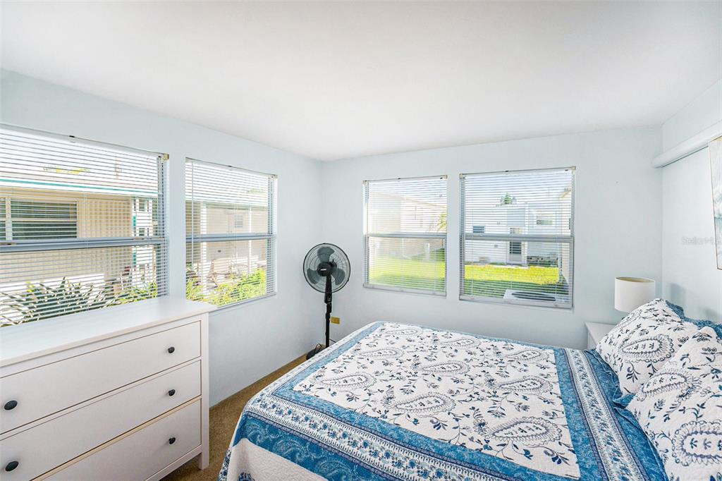 34527 Violet Drive Pinellas Park, FL 33781 - Photo 5 of 27 a bed room with a bed and a window