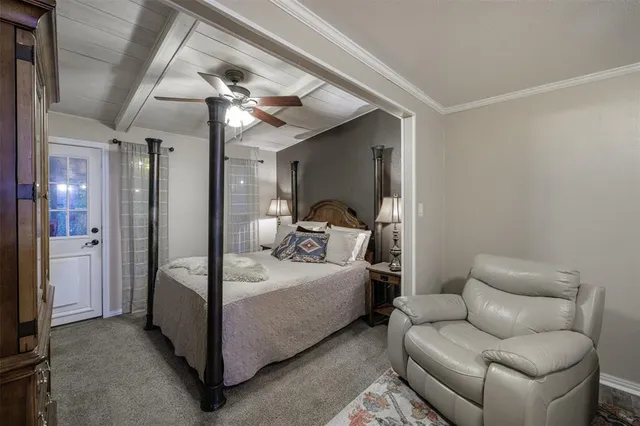 a work room with furniture and a flat screen tv