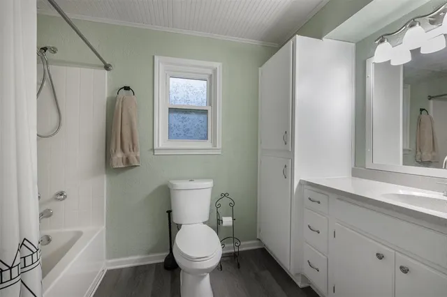 a bedroom with bed and a chandelier