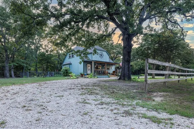 a house with trees in the background