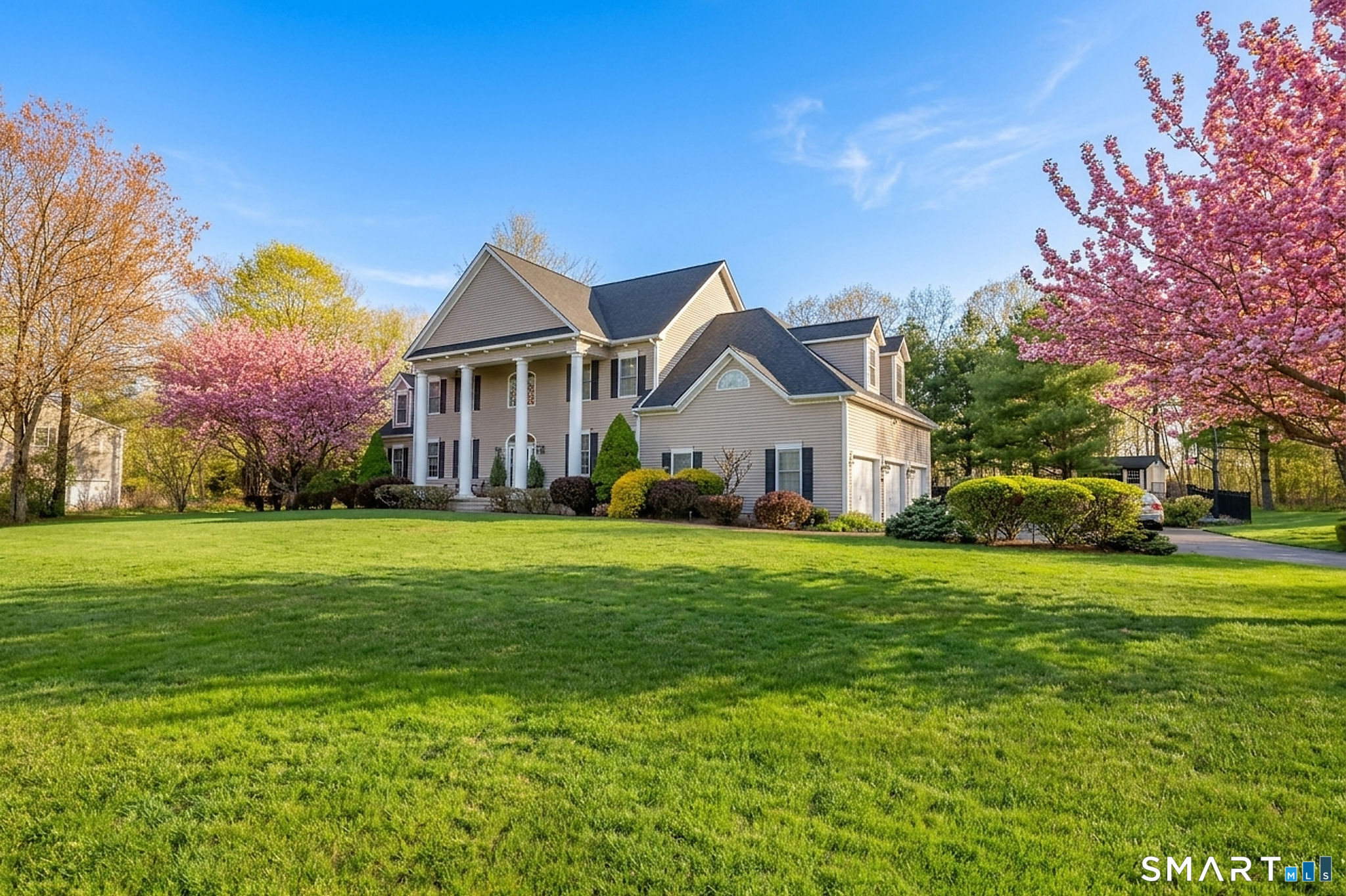 170 Devonshire Lane Madison, CT 06443 - Photo 2 of 39 a front view of a house with a yard