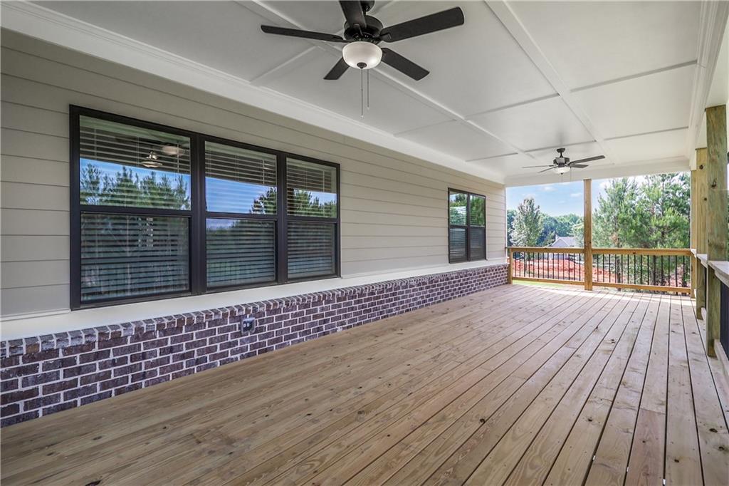 2113 Stonegate Way Monroe, GA 30656 - Photo 42 of 43 en empty room with wooden floor and balcony