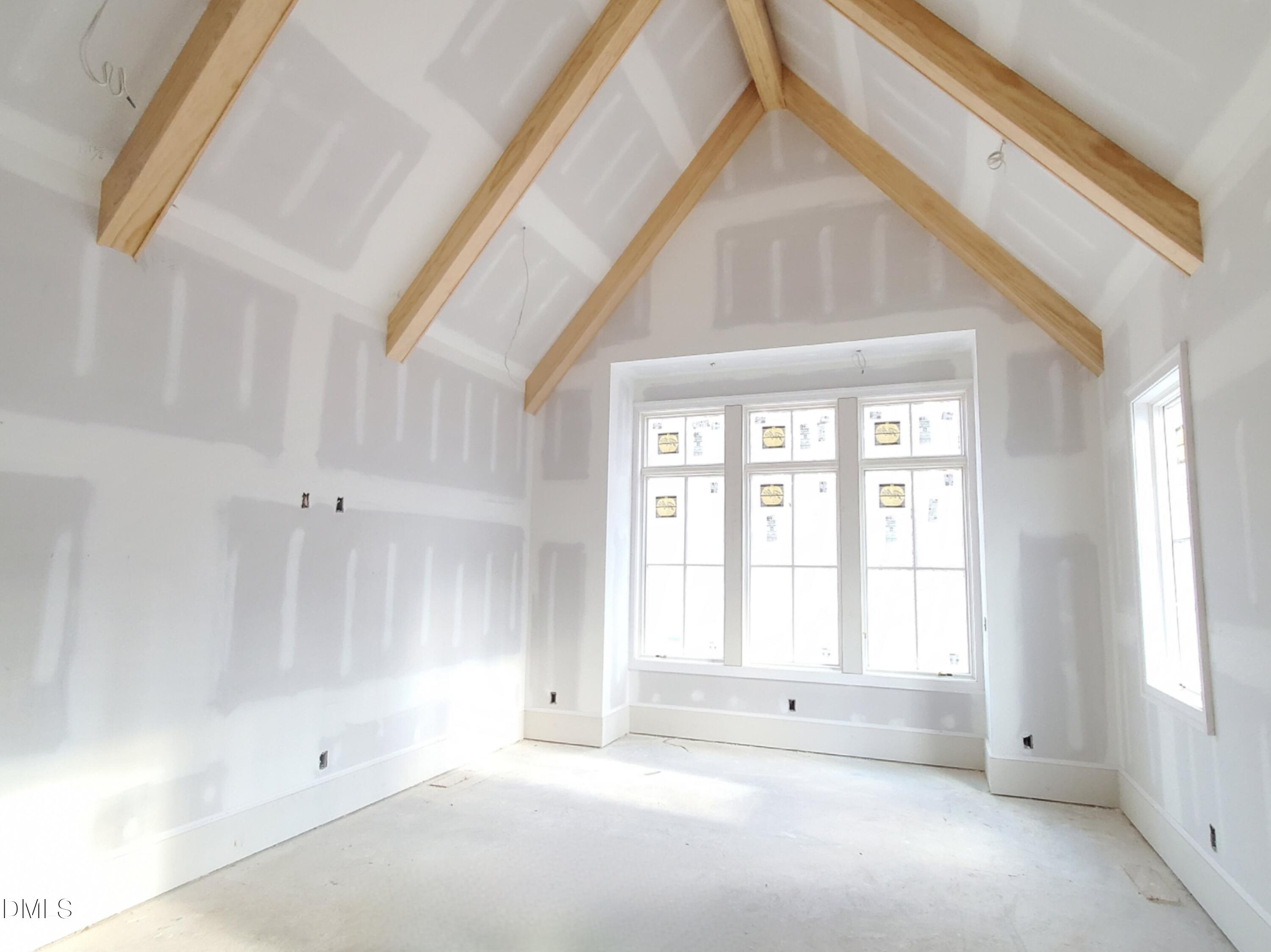 6508 Sanctuary Falls Drive Raleigh, NC 27614 - Photo 10 of 41 a view of an empty room with a window