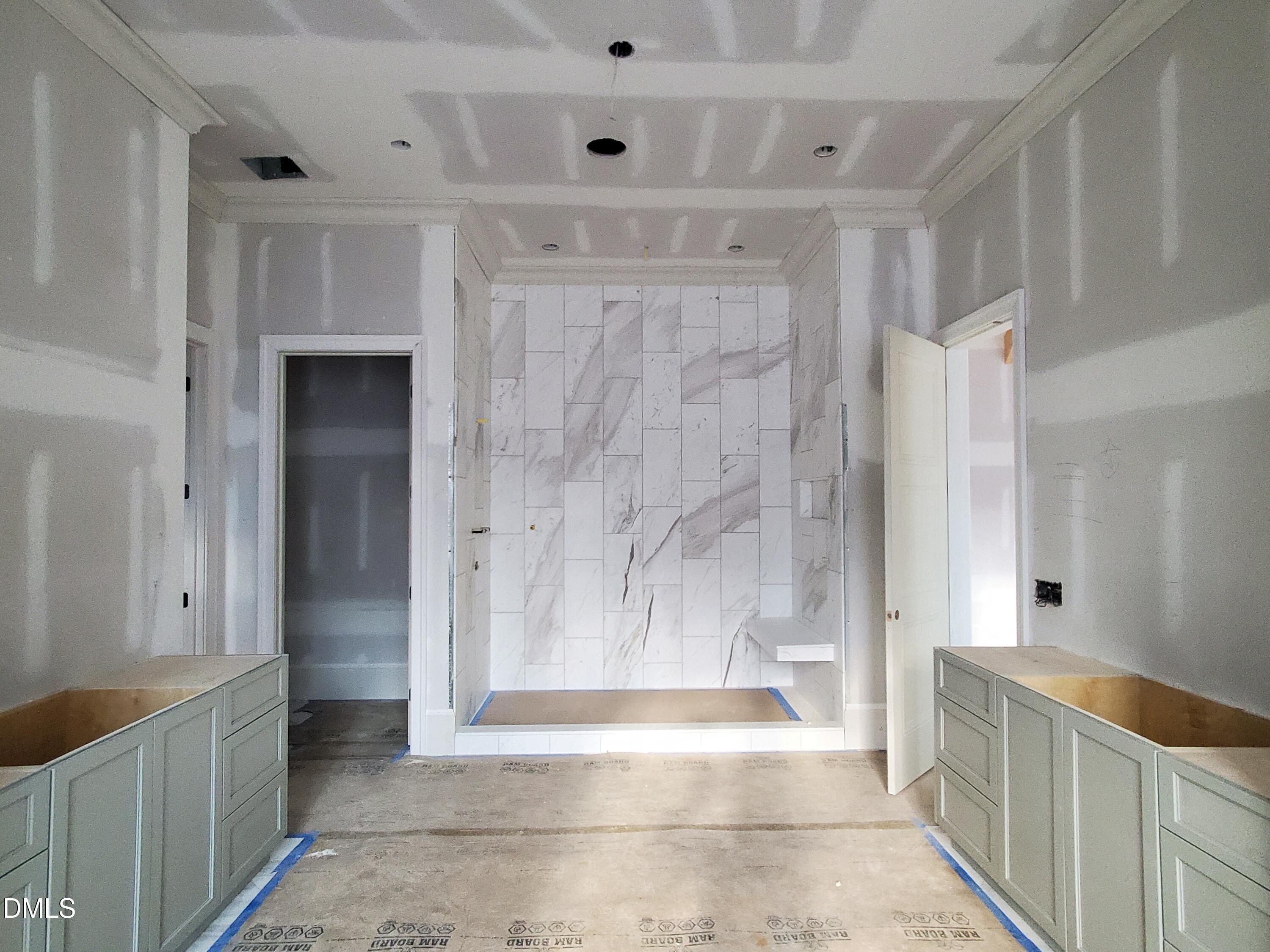 6508 Sanctuary Falls Drive Raleigh, NC 27614 - Photo 12 of 41 a bathroom with a tub shower and sink