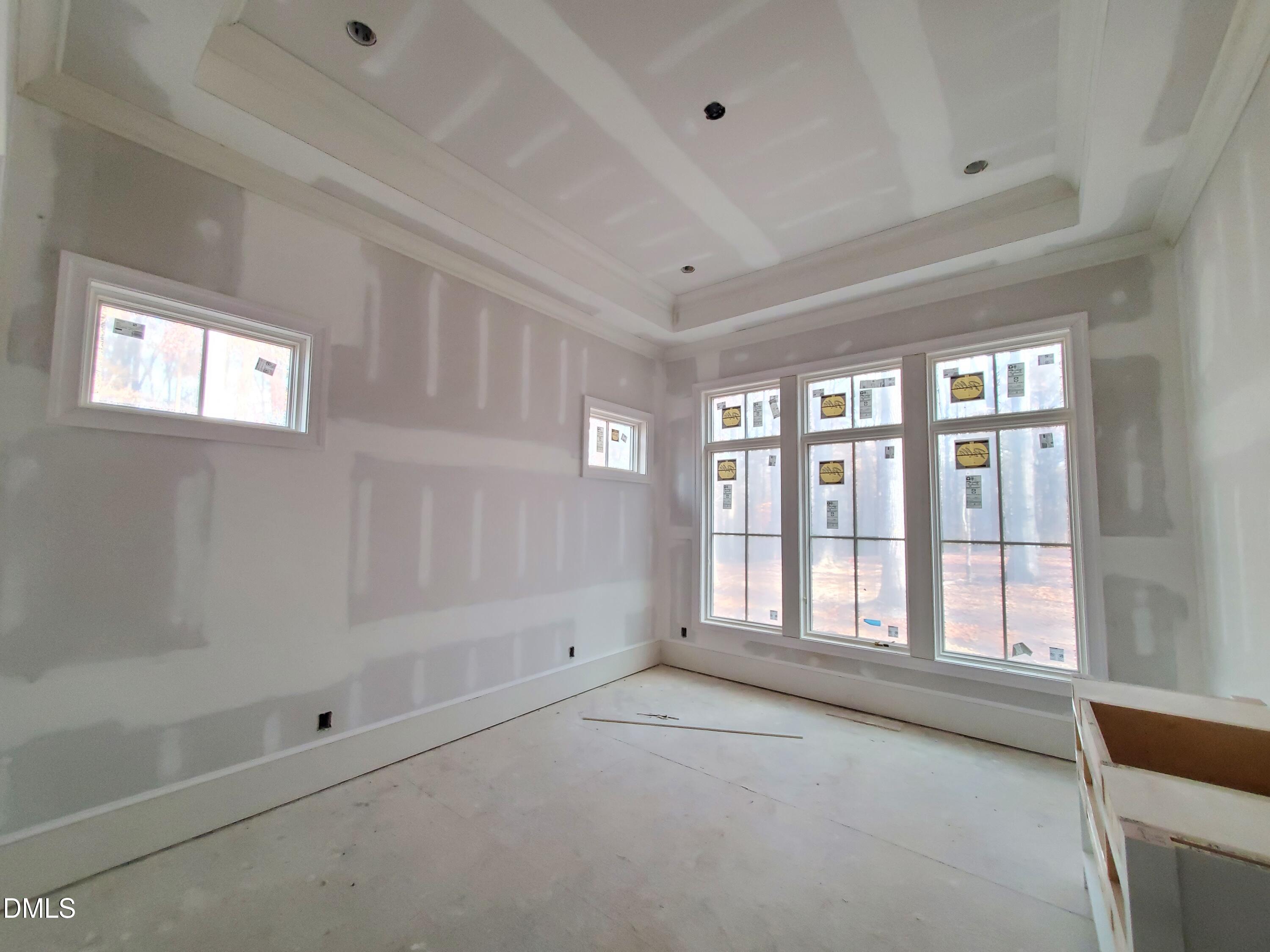 6508 Sanctuary Falls Drive Raleigh, NC 27614 - Photo 14 of 41 a view of an empty room with a window