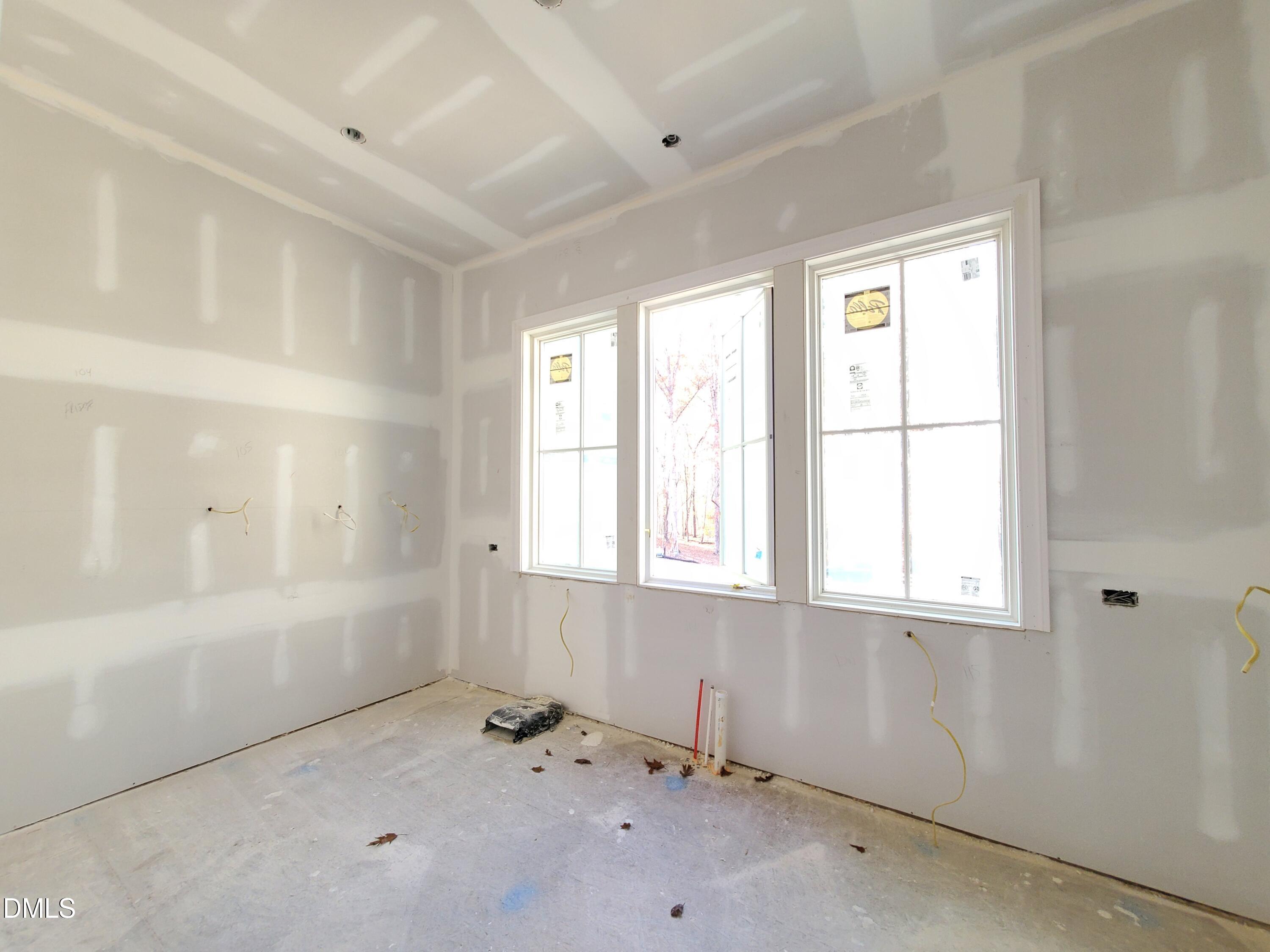 6508 Sanctuary Falls Drive Raleigh, NC 27614 - Photo 15 of 41 a view of an empty room with a window
