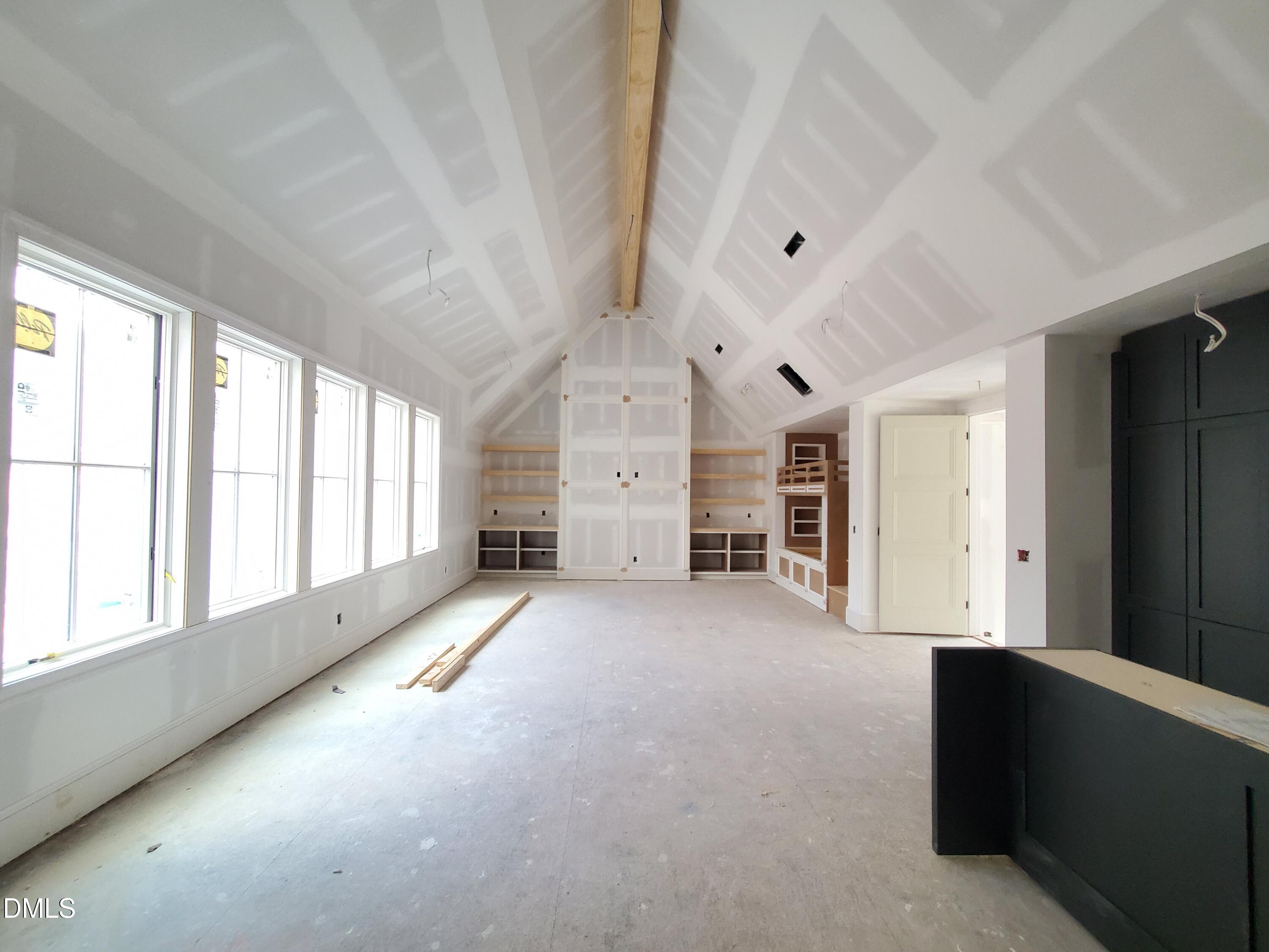 6508 Sanctuary Falls Drive Raleigh, NC 27614 - Photo 19 of 41 an empty room with windows