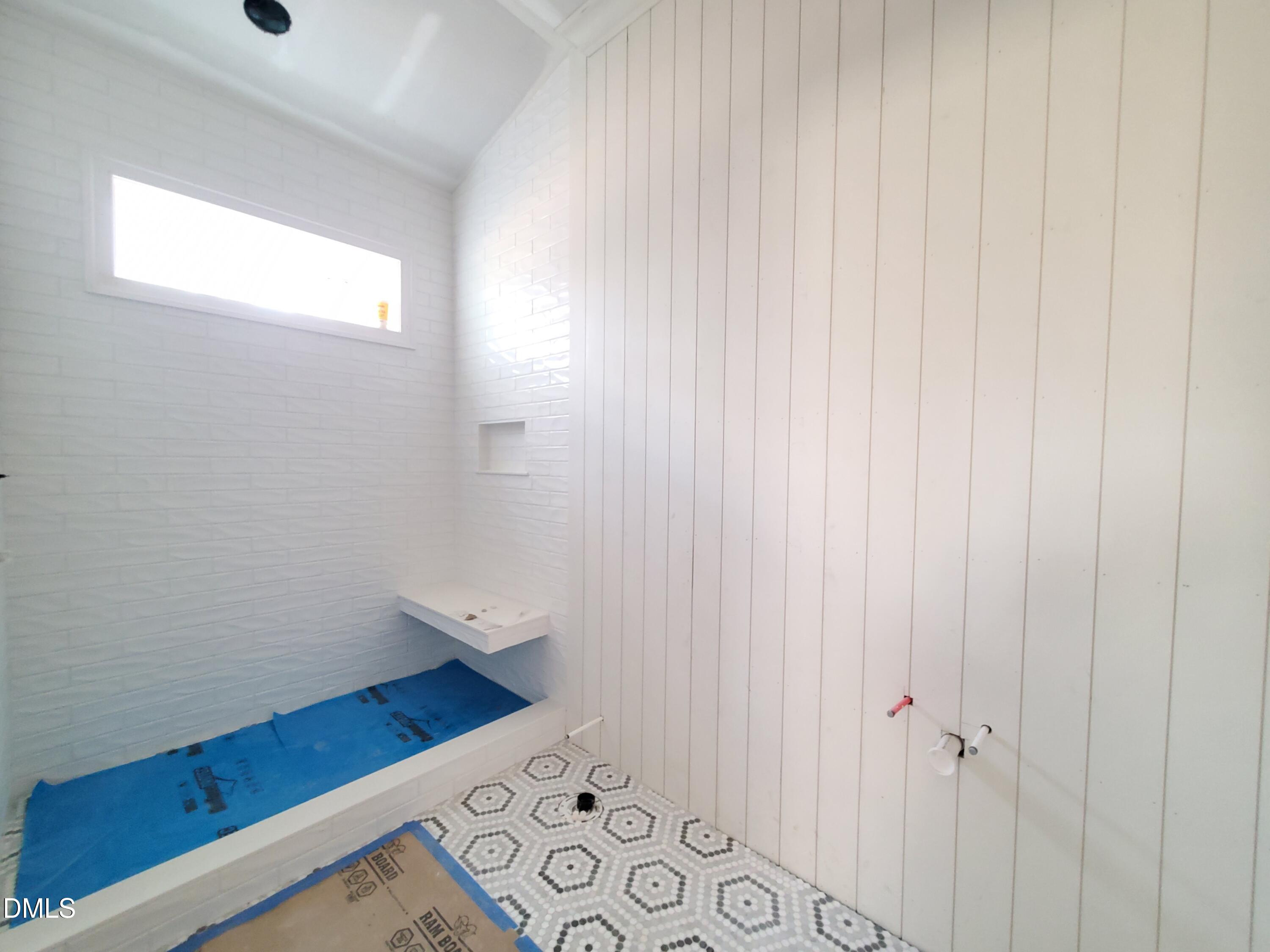 6508 Sanctuary Falls Drive Raleigh, NC 27614 - Photo 24 of 41 a bathroom with a bathtub and shower