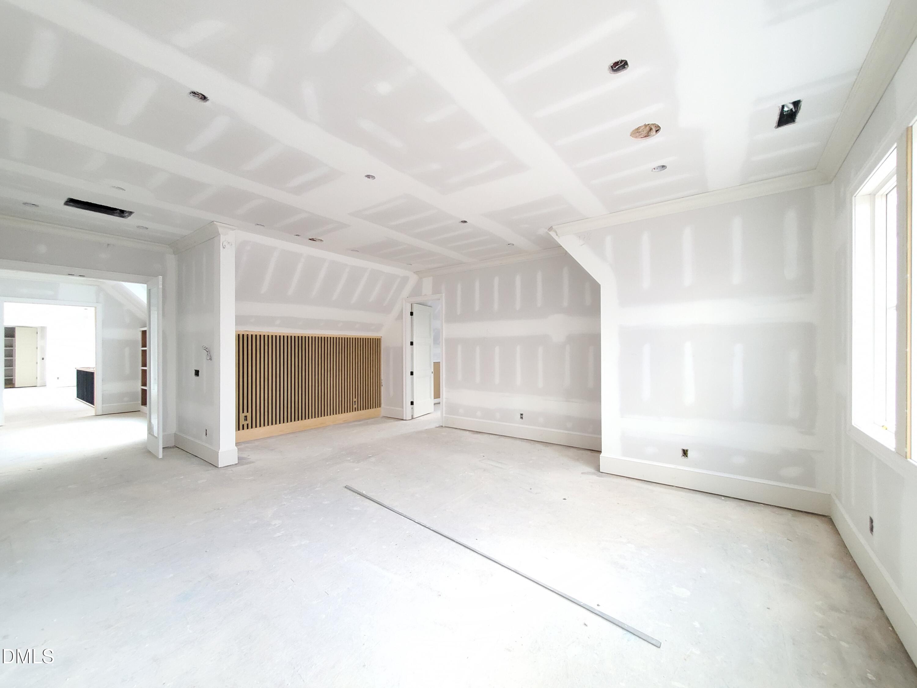 6508 Sanctuary Falls Drive Raleigh, NC 27614 - Photo 31 of 41 a view of empty room with a fireplace and windows