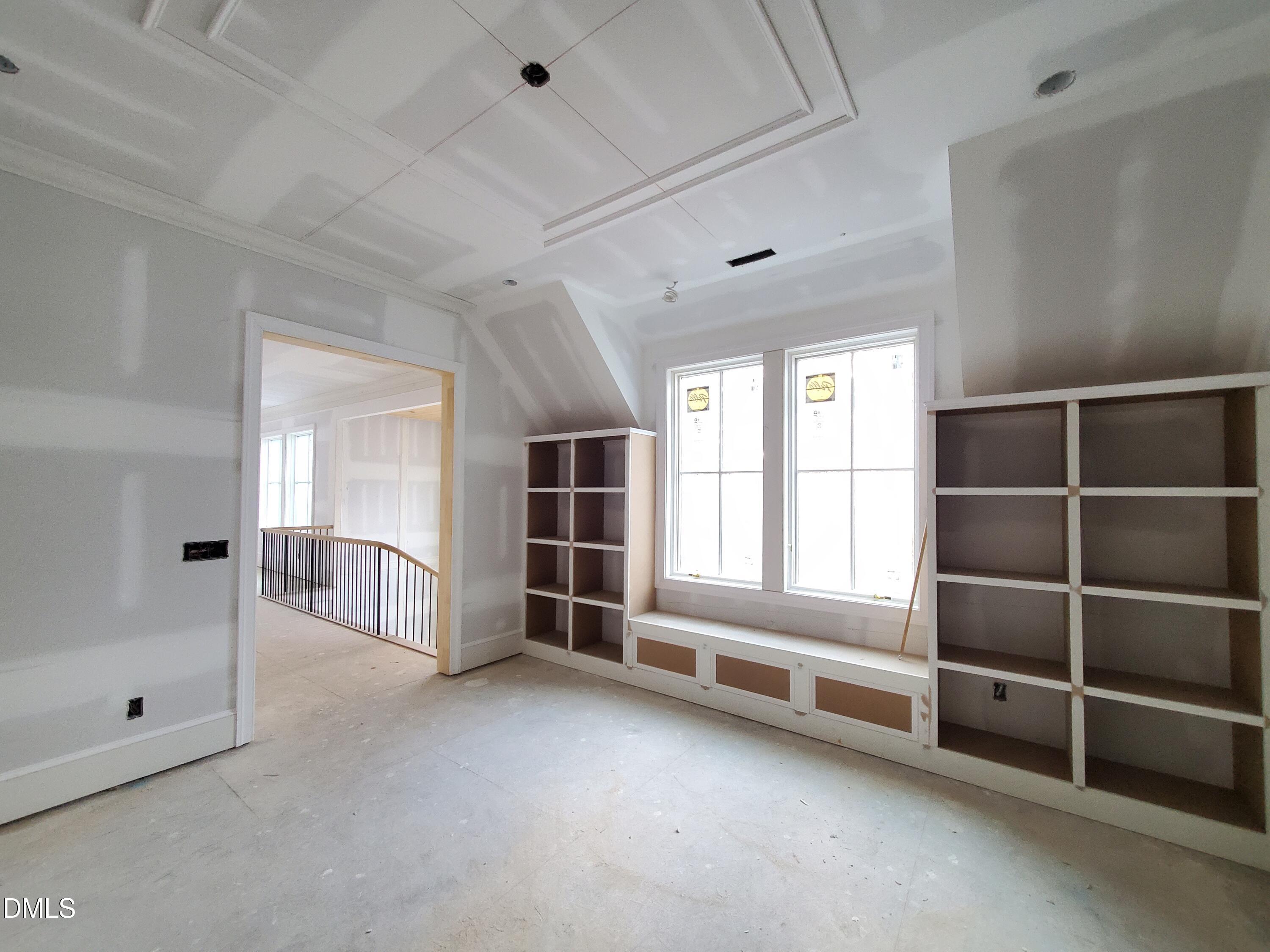 6508 Sanctuary Falls Drive Raleigh, NC 27614 - Photo 34 of 41 a view of empty room with wooden floor and windows