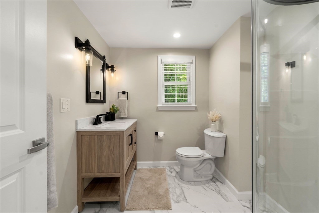 16 Churchill Road Plympton, MA 02367 - Photo 27 of 42 a bathroom with a toilet sink and mirror