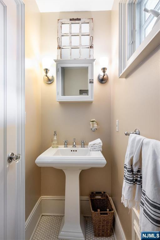 111 Montclair Avenue Montclair, NJ 07042 - Photo 21 of 46 a bathroom with a sink and a mirror