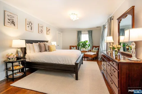 a bed room with a bed and a lamp