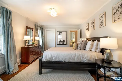 a bedroom with a bed and a table