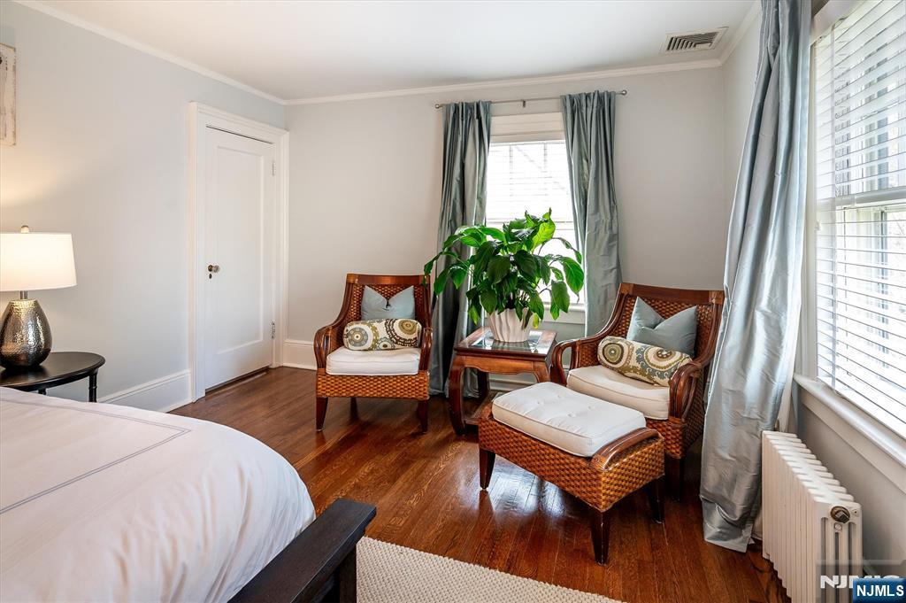111 Montclair Avenue Montclair, NJ 07042 - Photo 26 of 46 a bedroom with a bed and wooden floor