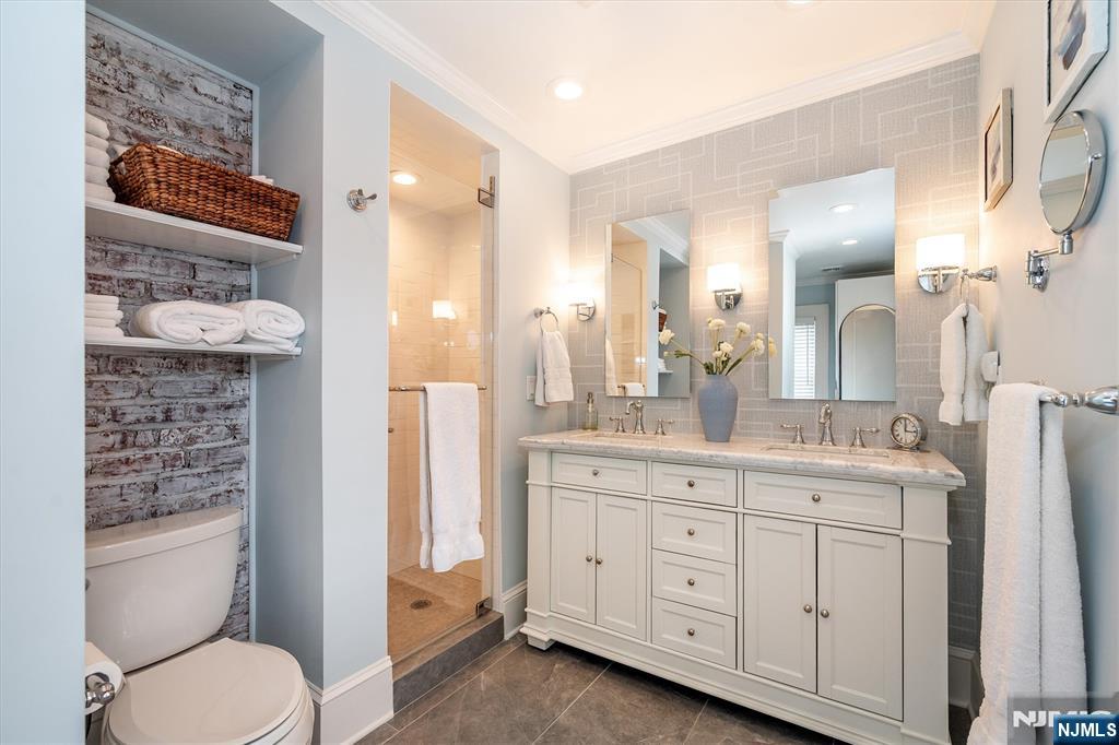 111 Montclair Avenue Montclair, NJ 07042 - Photo 28 of 46 a bathroom with a granite countertop toilet sink and a mirror