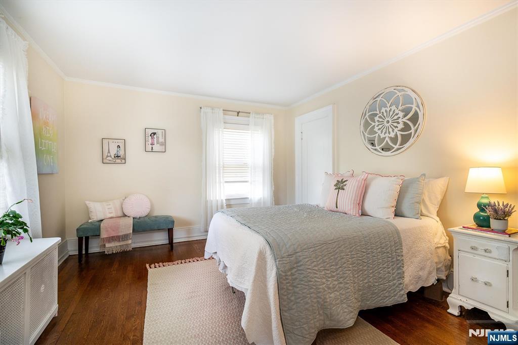 111 Montclair Avenue Montclair, NJ 07042 - Photo 29 of 46 a bedroom with a bed and chair