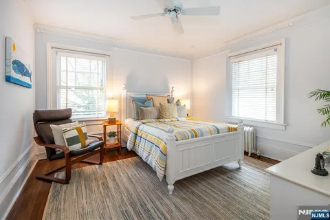 a bedroom with a bed and a table in it