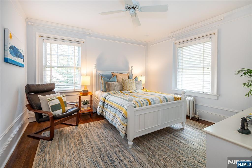 111 Montclair Avenue Montclair, NJ 07042 - Photo 31 of 46 a bedroom with a bed and a table in it