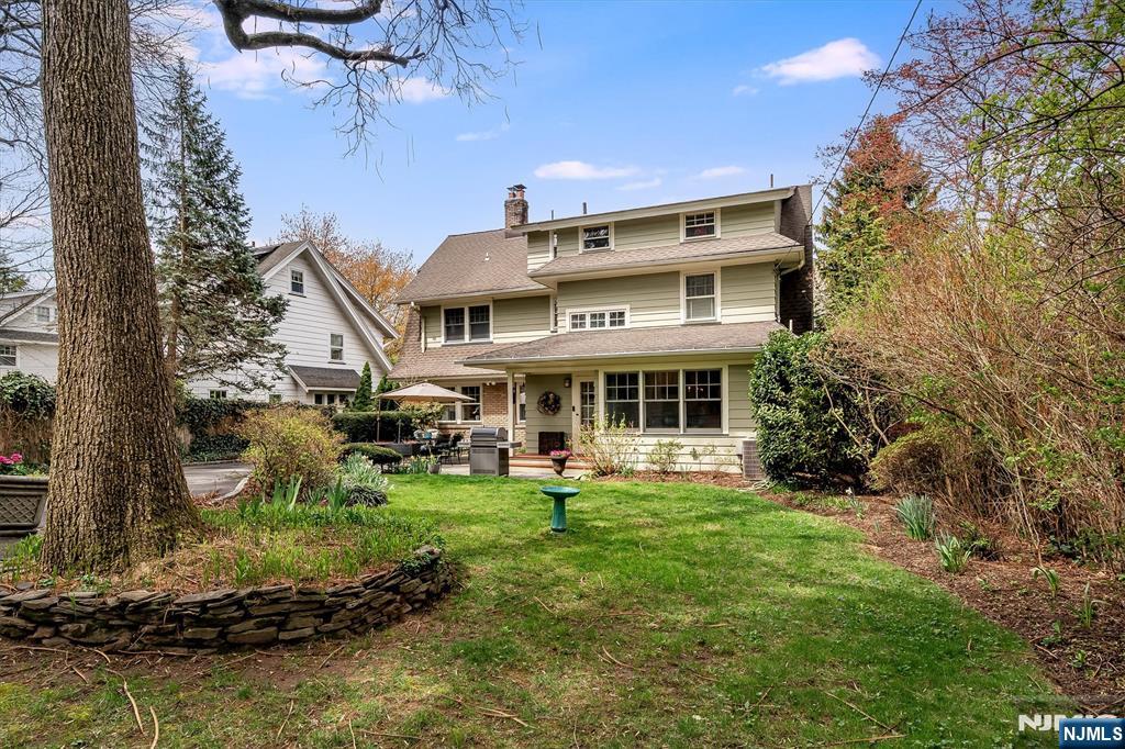 111 Montclair Avenue Montclair, NJ 07042 - Photo 44 of 46 a front view of a house with a yard table and chairs