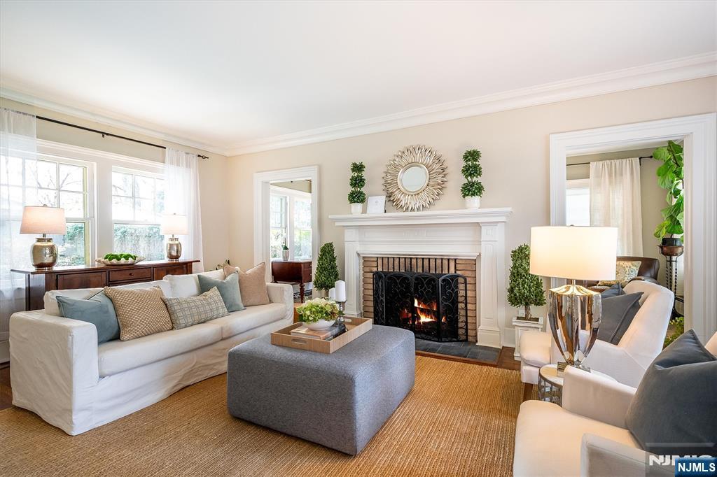 111 Montclair Avenue Montclair, NJ 07042 - Photo 5 of 46 a living room with furniture and a fireplace