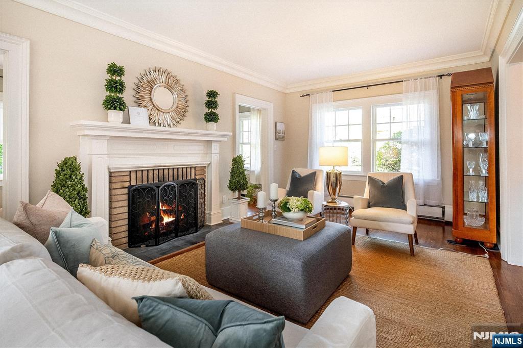 111 Montclair Avenue Montclair, NJ 07042 - Photo 6 of 46 a living room with furniture and a fireplace