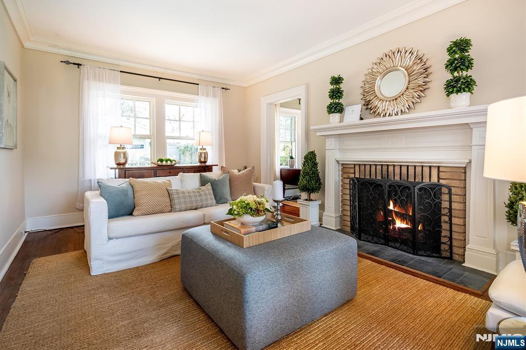 111 Montclair Avenue Montclair, NJ 07042 - Photo 7 of 46 a living room with furniture and a fireplace