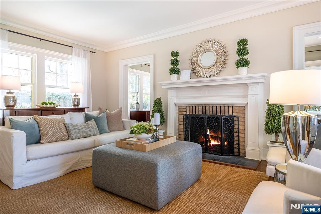 111 Montclair Avenue Montclair, NJ 07042 - Photo 8 of 46 a living room with furniture and a fireplace