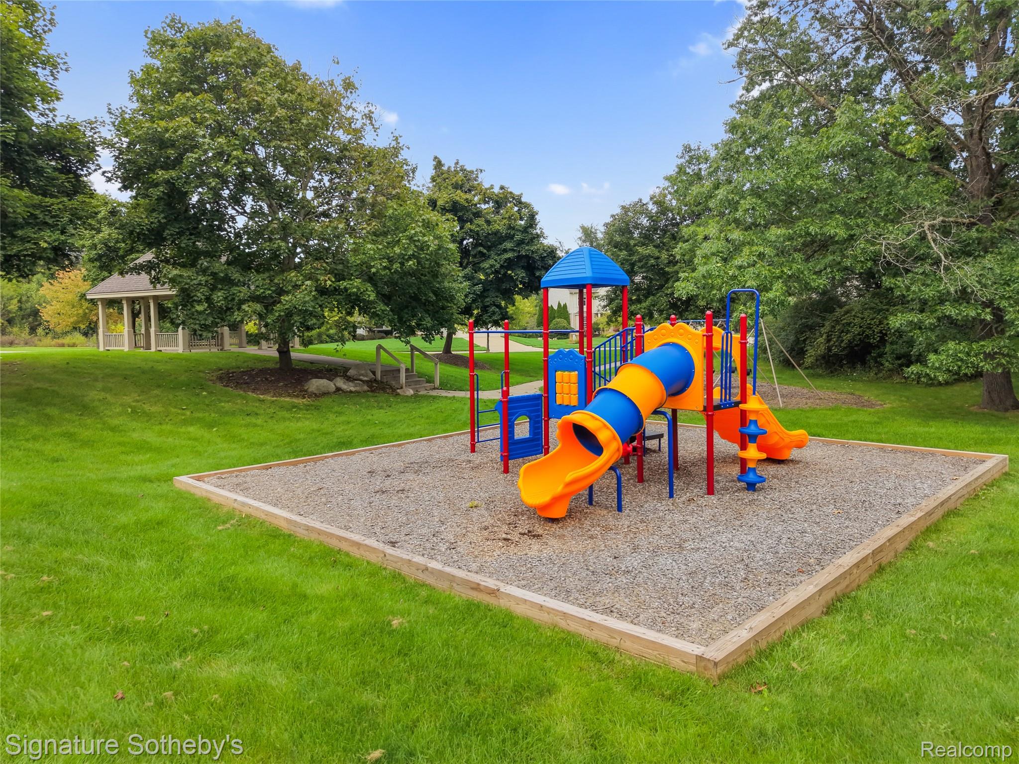 170 Fairhill Way Howell, MI 48843 - Photo 54 of 60 Play structure surrounded by grass area and mature trees