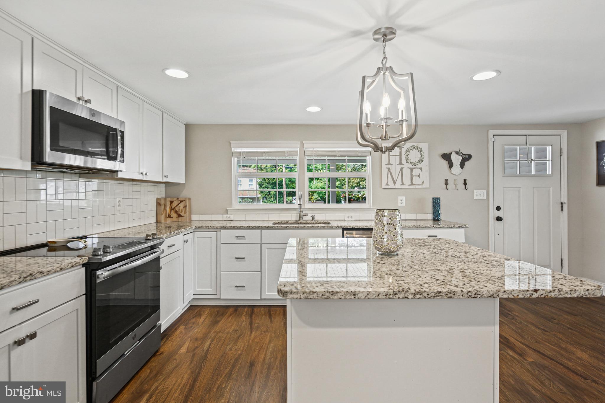 4535 Salem Bottom Road Westminster, MD 21157 - Photo 11 of 43 Kitchen with granite countertops and backsplash