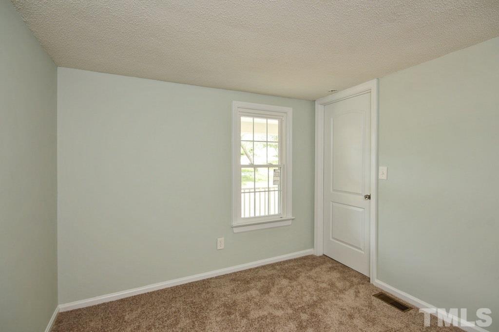 2959 Federal Road Benson, NC 27504 - Photo 14 of 20 an empty room with windows