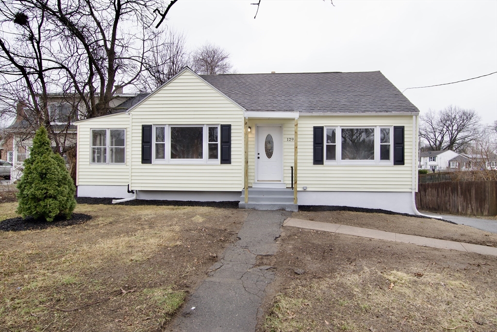 1295 Bay Street Springfield, MA 01109 - Photo 1 of 42 a front view of a house with a yard