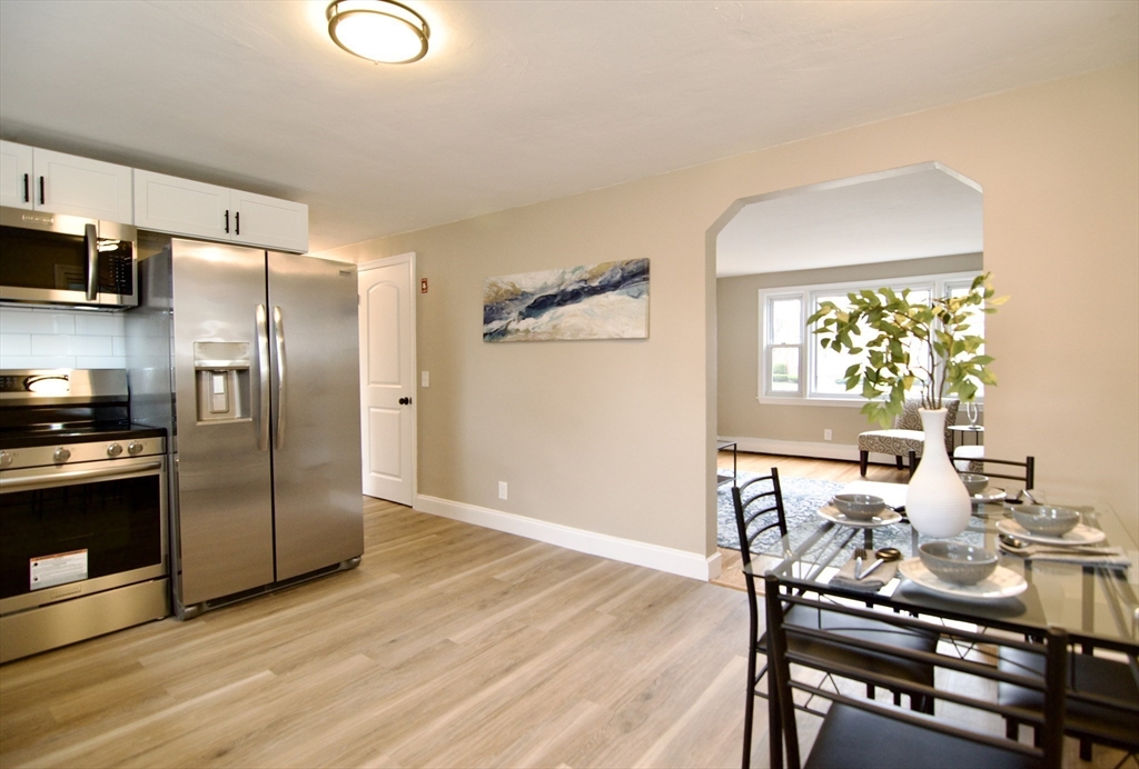 1295 Bay Street Springfield, MA 01109 - Photo 14 of 42 a kitchen with stainless steel appliances granite countertop a refrigerator and a stove top oven