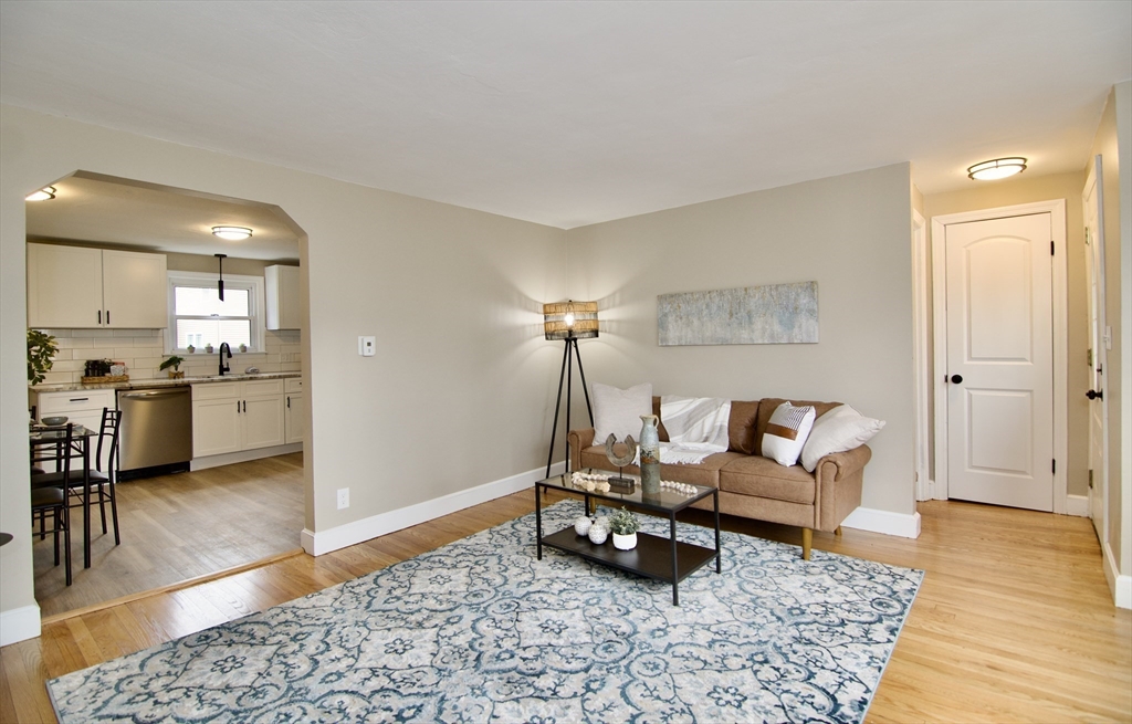 1295 Bay Street Springfield, MA 01109 - Photo 20 of 42 a living room with furniture and a rug