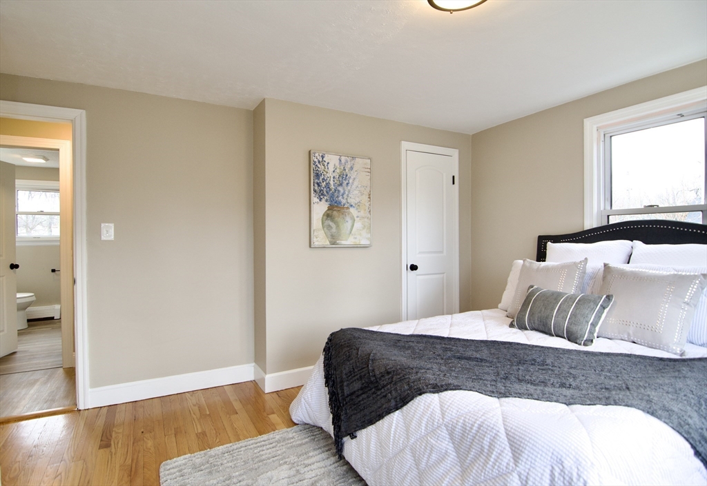 1295 Bay Street Springfield, MA 01109 - Photo 26 of 42 a bedroom with a bed and wooden floor